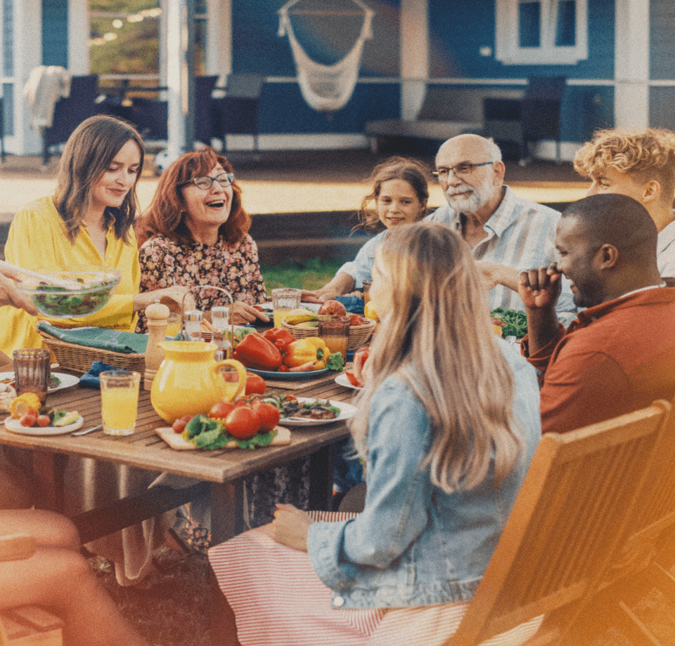 Family enjoying an outdoor meal together, highlighting the convenience of propane exchange for cooking